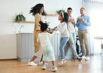 Happy, dance and jump with big family in kitchen for bonding, weekend and celebration fun. Wellness, music and playing with children and mother for dancing for happiness, affection and holiday