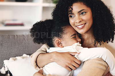 Buy stock photo Love, black family and hug by girl and mother on a sofa, happy and relax in their home together. Mom, daughter and embrace on a couch, cheerful and content while sharing a sweet moment of bonding