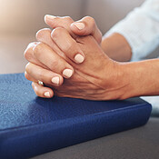 Bible, worship and hands of old woman in living room for religion, book and Christian  faith. Spiritual, God and prayer with senior lady praying with holy text at  home for wellness, believe and goal