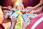 Hands, phone and networking on mockup for sports collaboration, social media or communication outdoors. Group of football players on smartphone for 5G connection, share or mobile app sync in circle