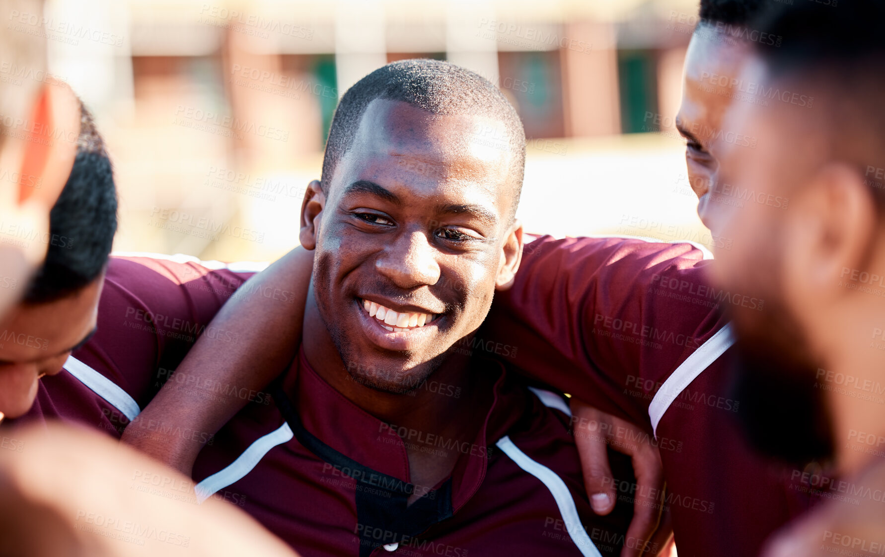 Buy stock photo Sports, huddle and man athlete on a field for motivation or strategy planning with his team. Fitness, workout and happy African male rugby player talking with his sport group before a match or game.