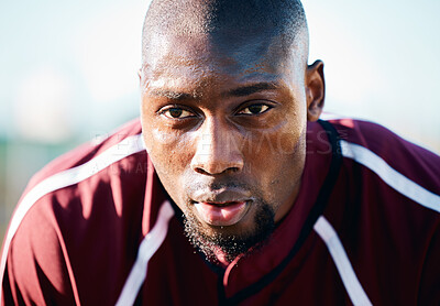 Buy stock photo Breathing, focus and black man in sports training, competition or game on rugby field and blue sky. Breathe, sweating and tired athlete or person thinking of workout, exercise or fitness strategy