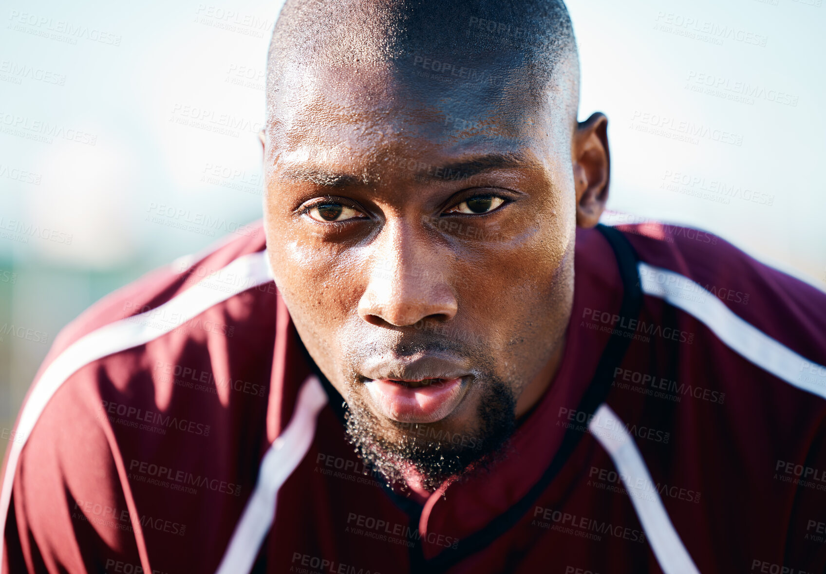 Buy stock photo Breathing, focus and black man in sports training, competition or game on rugby field and blue sky. Breathe, sweating and tired athlete or person thinking of workout, exercise or fitness strategy