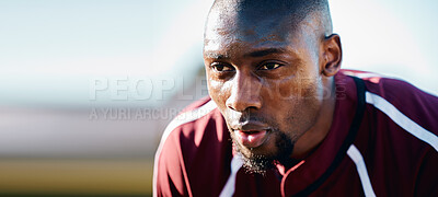 Buy stock photo Tired, breathing and black man in sports training, competition or game focus on rugby field, blue sky mockup. Breathe, sweating and athlete or person thinking of workout, exercise or fitness strategy