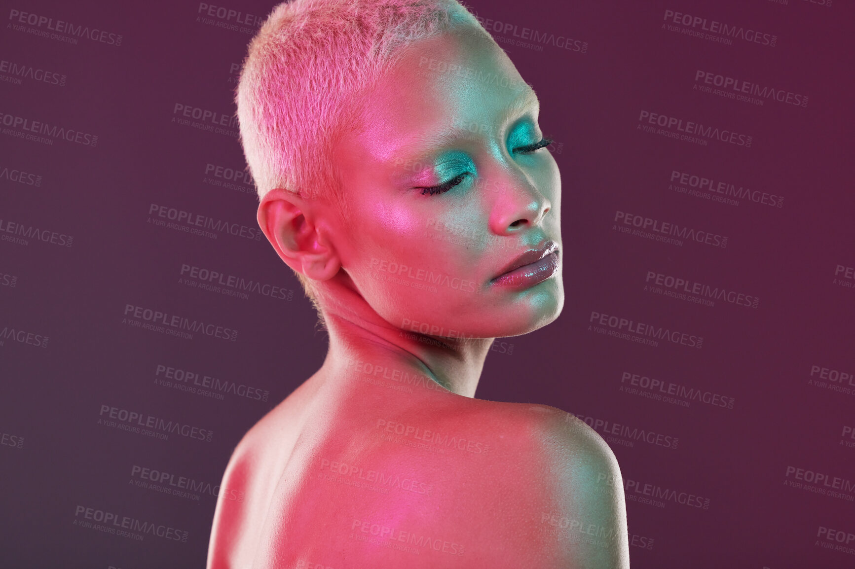 Buy stock photo Skincare, cosmetics and woman with neon makeup and lights for creative advertising on studio background. Cyberpunk, product placement and model isolated for and futuristic beauty and art mockup space