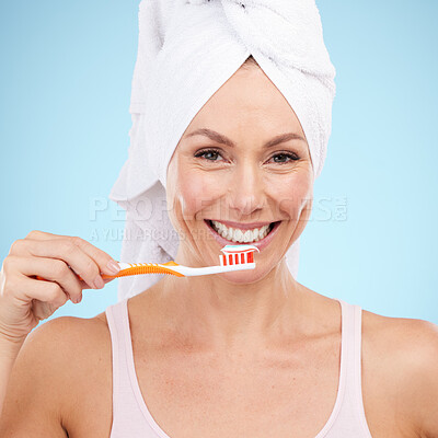Buy stock photo Portrait, woman smile and toothbrush isolated on blue background for dental, mouth or orthodontics health. Beauty model or mature person for brushing teeth, cleaning product and toothpaste in studio
