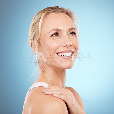 Buy stock photo Happy, face or senior model with beauty after skincare or self care routine isolated on blue background. Shoulder, studio or beautiful woman with healthy natural facial treatment or grooming results 