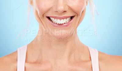Buy stock photo Smile, teeth whitening and woman mouth in studio, blue background and facial wellness. Closeup female model, clean dental and happy face of fresh breath, tooth implant and healthy aesthetic beauty 