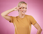 Woman, peace and portrait on pink background, smile and studio pose. Happy female face, v sign and hands emoji of cool lady model for victory, winking and fun mood with happiness, review and success