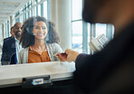 Black woman, glass window and ticket check at airport or with paper for travel or box office service. Customer person at cashier consultant booth counter for work booking and buying pass at seller