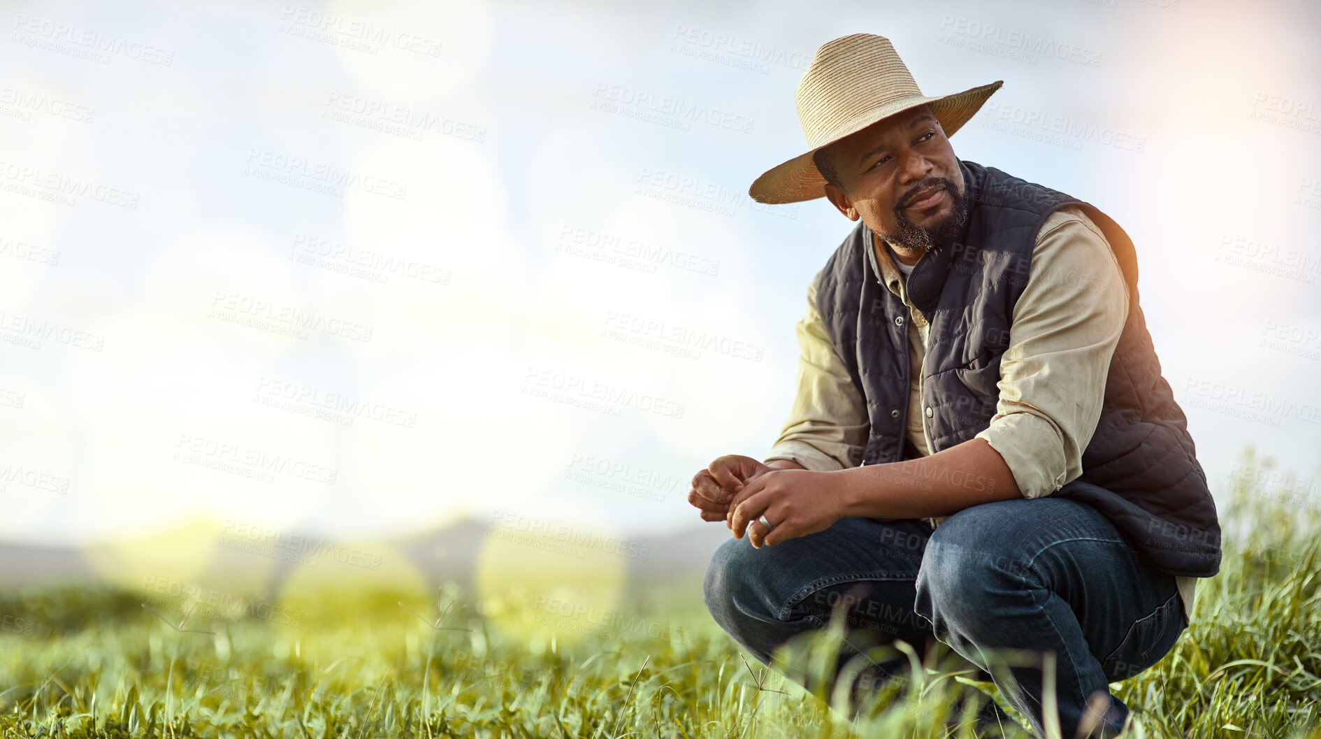 Buy stock photo Farmer, black man and mockup for agriculture and sustainability outdoor on an agro farm with bokeh. Person on grass field thinking about farming innovation, growth and ecology in the countryside