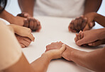 Holding hands, praying and people worship for peace, trust or faith in God at a table together. Pray, Christian and community by group hand in prayer, praise or blessing while united in Jesus Christ