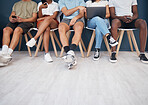 People, legs and sitting in waiting room networking for interview, social media or marketing team. Leg of group in wait with technology for network, hiring or recruitment on chairs in row on mockup