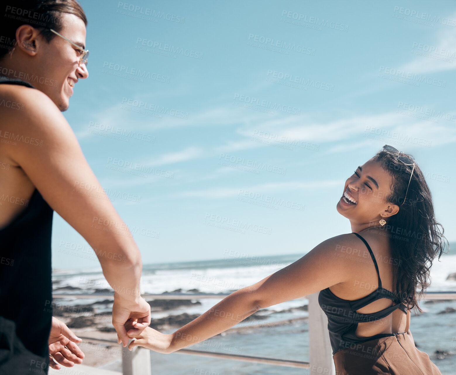 Buy stock photo Couple of friends, laughing or holding hands by beach, ocean or sea in romance mock up, trust or summer holiday fun. Smile, happy man or bonding woman in travel location, funny game or freedom play