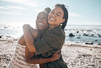 Women, bonding and friends hug by beach, sea or ocean in summer holiday, support vacation or girls travel trip. Smile, happy and black people in embrace, social gathering or relax in nature location