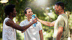 Fitness, water bottle and friends toast in nature after workout, exercise or training. Sports, comic and group of happy men cheers with liquid to celebrate goals, targets and laughing at funny joke.