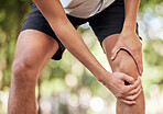 Hands, legs injury and knee pain at park after training, workout or exercise accident. Sports, fitness and man or runner with fibromyalgia, inflammation or arthritis after 
exercising, running or jog