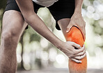 Legs injury, hands and knee pain at park after training, workout or exercise accident. Sports, fitness and man or runner with fibromyalgia, inflammation or arthritis after 
exercising, running or jog