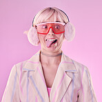 Fashion, comic face and a woman quirky in studio with tongue out on a pink background. Aesthetic model person with funny glasses for edgy vaporwave trend with creativity, comedy and color for art