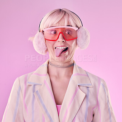 Buy stock photo Fashion, comic face and a woman quirky in studio with tongue out on a pink background. Aesthetic model person with funny glasses for edgy vaporwave trend with creativity, comedy and color for art
