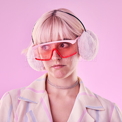 Buy stock photo Woman, fashion and unique on a pink background in studio with funny glasses for cyberpunk style. Face of edgy, trendy or retro aesthetic person thinking vaporwave, creativity and art color clothes