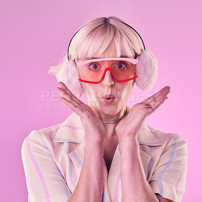 Buy stock photo Fashion, portrait and a woman quirky in studio for wow, surprise and comic face on pink background. Aesthetic model person with glasses and earmuffs for edgy vaporwave trend with creativity and color