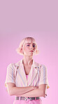 Angry, serious and portrait of a woman with arms crossed isolated on a pink background in a studio. Expert, professional and stylish, trendy and fashionable girl with frustrated expression and mockup