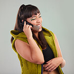 Mockup, phone call and woman in studio happy, laughing and talking against a grey background. Smartphone, conversation and girl with humor sharing funny, comedy or joke on a call on isolated space