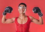 Portrait, boxing and strong gay man with motivation isolated on a red background in a studio. Fight, fitness and lgbt person showing muscle from self defense exercise, training and challenge