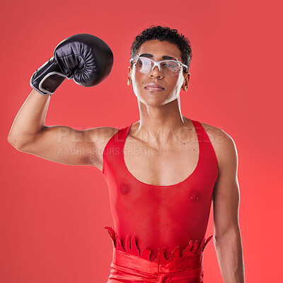 Buy stock photo Portrait, boxing and gay man with gloves for a fight isolated on a red background in a studio. Strong, fitness and lgbt person showing muscle from self defense exercise, training and challenge