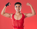 Strong, power and portrait of a gay man for boxing isolated on a red background in a studio. Strength, training and lgbt fighter showing muscle for a fight, self defense and sport on a backdrop