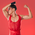 Man, studio and arm muscle kiss with wrestling, punk costume and makeup for lgbt aesthetic by red background. Young bodybuilder, gen z gay and fitness with strong body, self care and pride for health