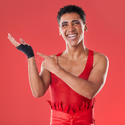 Buy stock photo Hands, mockup and portrait of gen z man pointing in studio for makeup, fashion and punk aesthetic on red background. Hand, gesture and product placement with face of mexican male advertising space