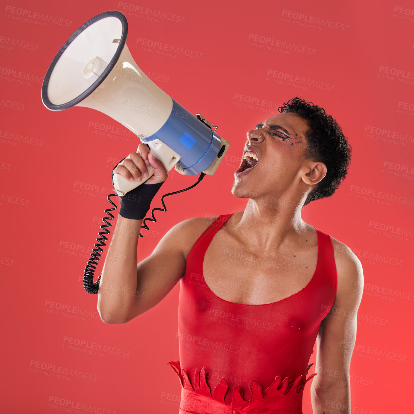 Buy stock photo Anger, gay and a man with a megaphone for protest isolated on a red background in a studio. Lgbt, freedom and person shouting and talking into a speaker for gen z rights and voice or riot on backdrop