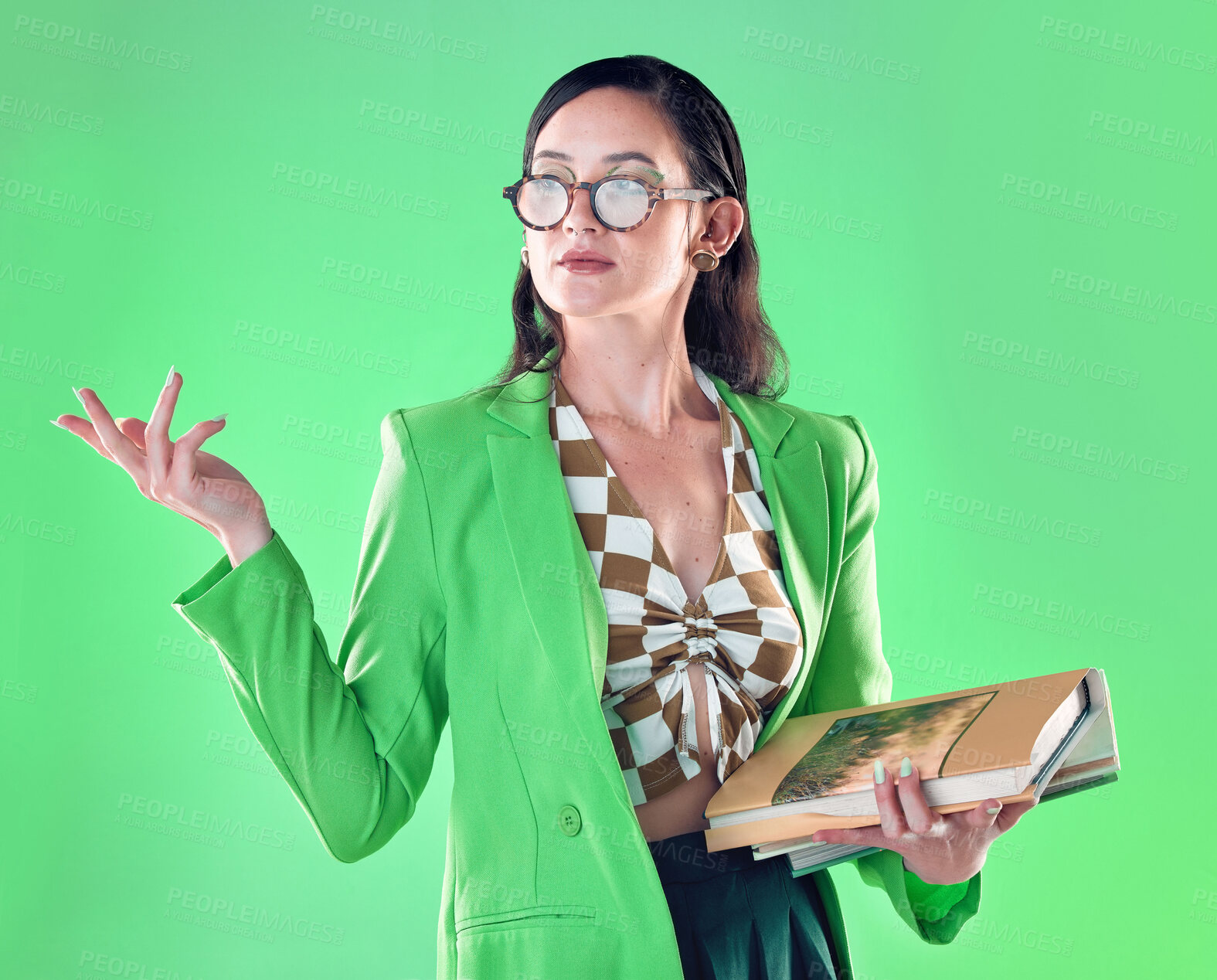 Buy stock photo Woman, books and teacher mockup in studio isolated on a green background. Gen z, education and smart female professor with product placement, advertising or marketing space while carrying textbooks.