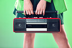 Radio, woman and music with retro technology and fashion, entertainment with station, funk and hands on green background. Style, vintage sound and audio equipment, female model with broadcast device