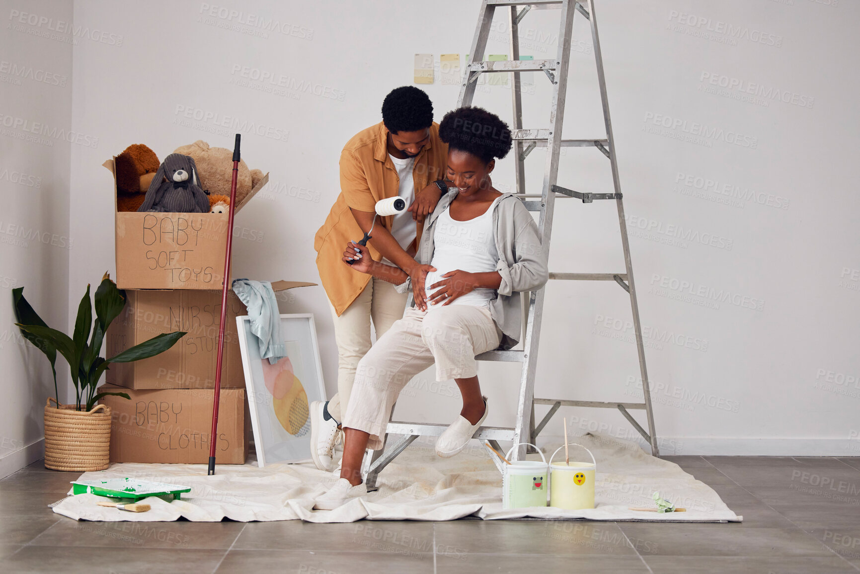 Buy stock photo Painting, pregnancy or home with a black couple in DIY, renovation or house remodel with a paintbrush or roller. Teamwork, partners or African man and pregnant woman excited about baby or new family