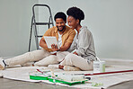 Painting, tablet or black couple in home renovation, diy or house remodel online shopping together. Digital, ecommerce choices or African man checking online with woman excited about family property 