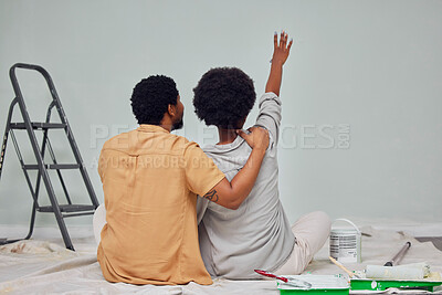 Buy stock photo Painting, wall or black couple planning DIY, home renovation or house remodel together on floor. Back view, pointing or African man loves speaking to young woman working with teamwork in partnership 