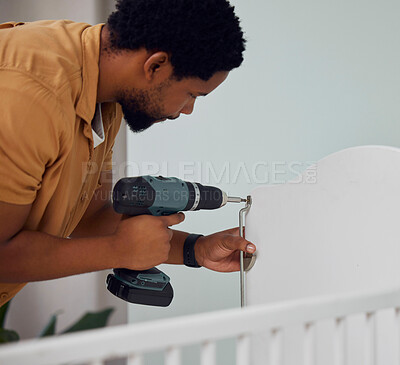 Buy stock photo Installation, drill and man building a crib while preparing for his new baby in the family home. Engineering, metal and African father doing maintenance or repairs on the bed in nursery at his house.