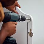 Building, construction and hands of a person with a drill for a baby bed for preparation in a house. Metal, maintenance and man with a mechanical tool to build a frame for a child to sleep in a home