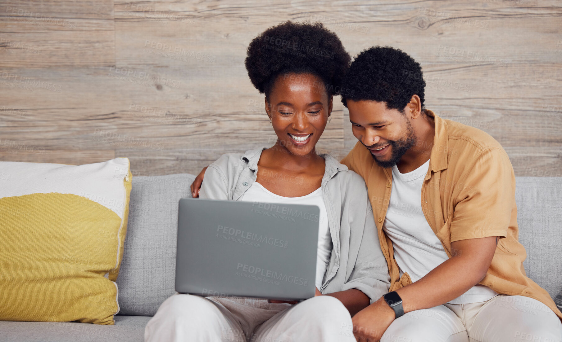 Buy stock photo Movie, internet and black couple with a laptop for social media, web and meme on the sofa. Looking, happy and African man and woman watching a show, reading email or comedy entertainment on a pc