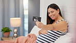 Pregnant, woman portrait and ultrasound in hand for baby development or growth. Happy person show baby scan photograph in bed for gynecology, pregnancy update and health or wellness in home bedroom