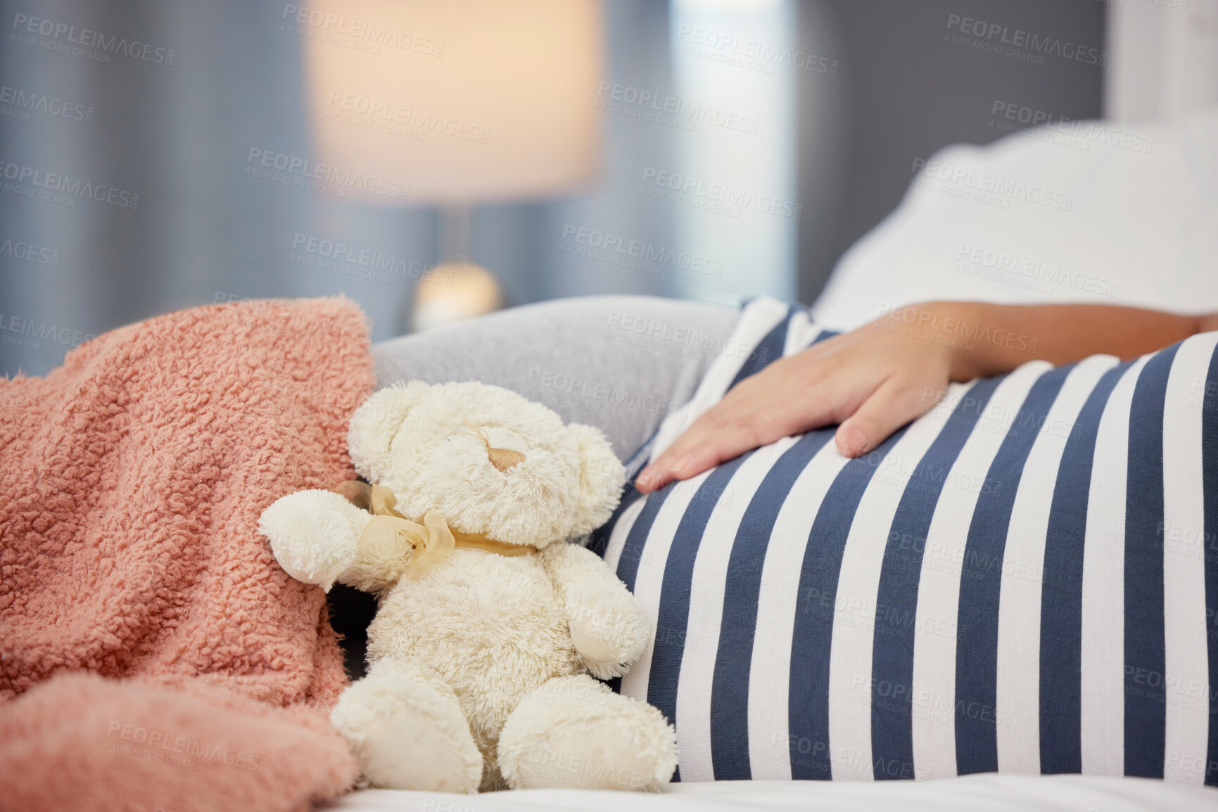 Buy stock photo Pregnant stomach, teddy bear and mother in bed with toy for baby, infant and affection at home. Pregnancy love, family and excited, loving and happy woman rest, relaxing and calm in bedroom