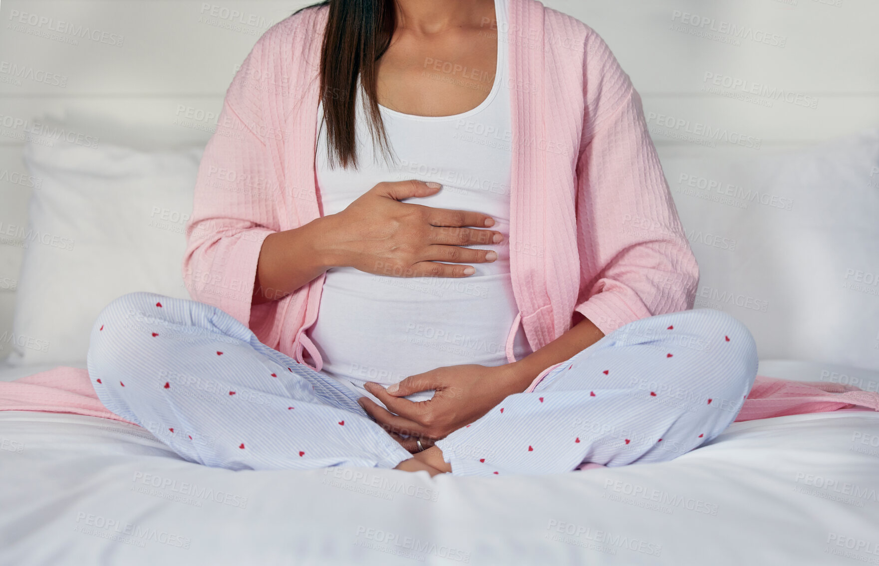 Buy stock photo Pregnant, hands on stomach and woman in bed holding belly for baby, infant and affection at home. Pregnancy love, family and excited, loving and happy mother rest, relaxing and calm in bedroom