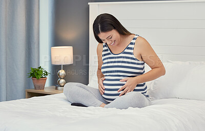 Buy stock photo Pregnant stomach, woman and home bedroom while happy about bonding and growth. Mother to be person with hands on abdomen for healthy pregnancy development, body wellness and care or love on her bed