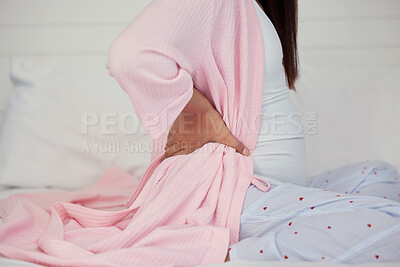 Buy stock photo Tired, healthcare and pregnant woman with back pain on a bed for rest, break and maternity leave. Sick, injury and girl with backache, fatigue and stress during pregnancy in a bedroom for motherhood