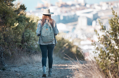 Buy stock photo Woman hiking, travel and trekking in nature park, adventure and fitness outdoor with backpack and exercise. Female hiker on trail, back view and walking with healthy active lifestyle and fresh air