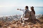 Pointing, view and couple on a mountain for hiking, travel and trekking in Switzerland. Relax, adventure and man and woman sitting on a cliff looking at the city from nature while on vacation
