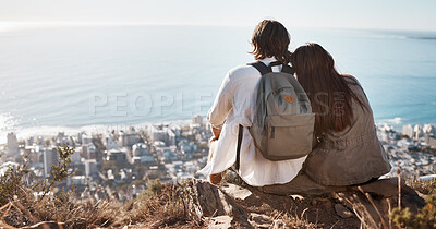 Buy stock photo Couple, travel and cityscape with ocean view for peace and calm while hiking with a backpack. Man and woman together on vacation in nature with love, care and support with a hug outdoor on mountain